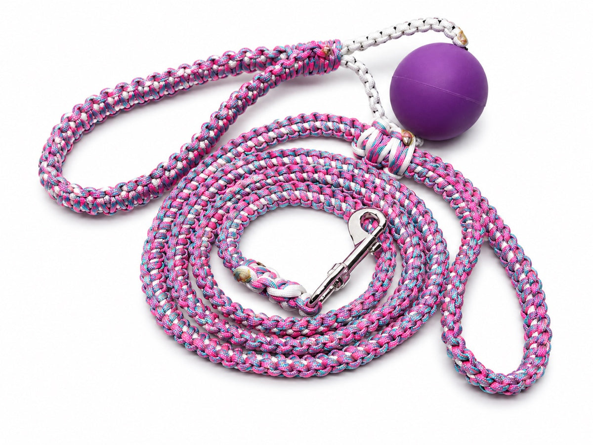 Pink and white paracord tug toy with purple ball